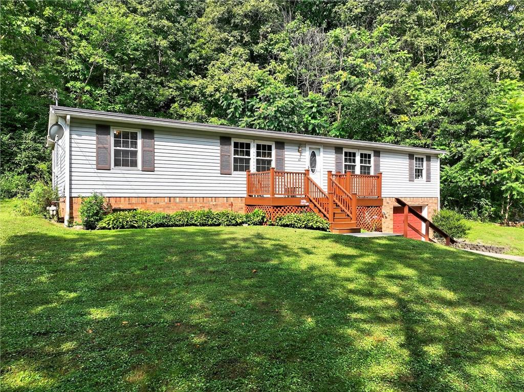 111 A Cowpath Road Aliquippa, PA 15001 - Photo 37 of 46 a backyard that has potted plants and a large tree