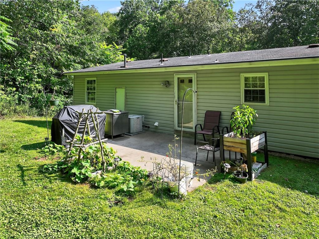 111 A Cowpath Road Aliquippa, PA 15001 - Photo 38 of 46 a backyard of a house with outdoor seating