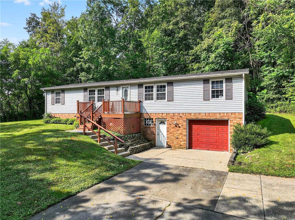 111 A Cowpath Road Aliquippa, PA 15001 - Photo 4 of 46 a front view of house with yard outdoor seating and green space