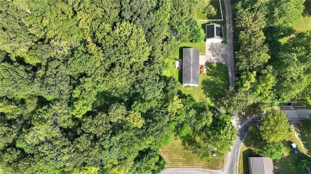 an aerial view of a golf course with parking space