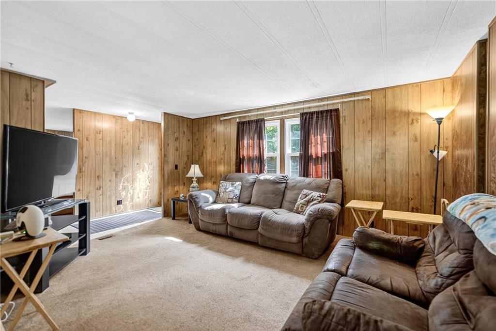 111 A Cowpath Road Aliquippa, PA 15001 - Photo 7 of 46 a living room with furniture a window and a flat screen tv