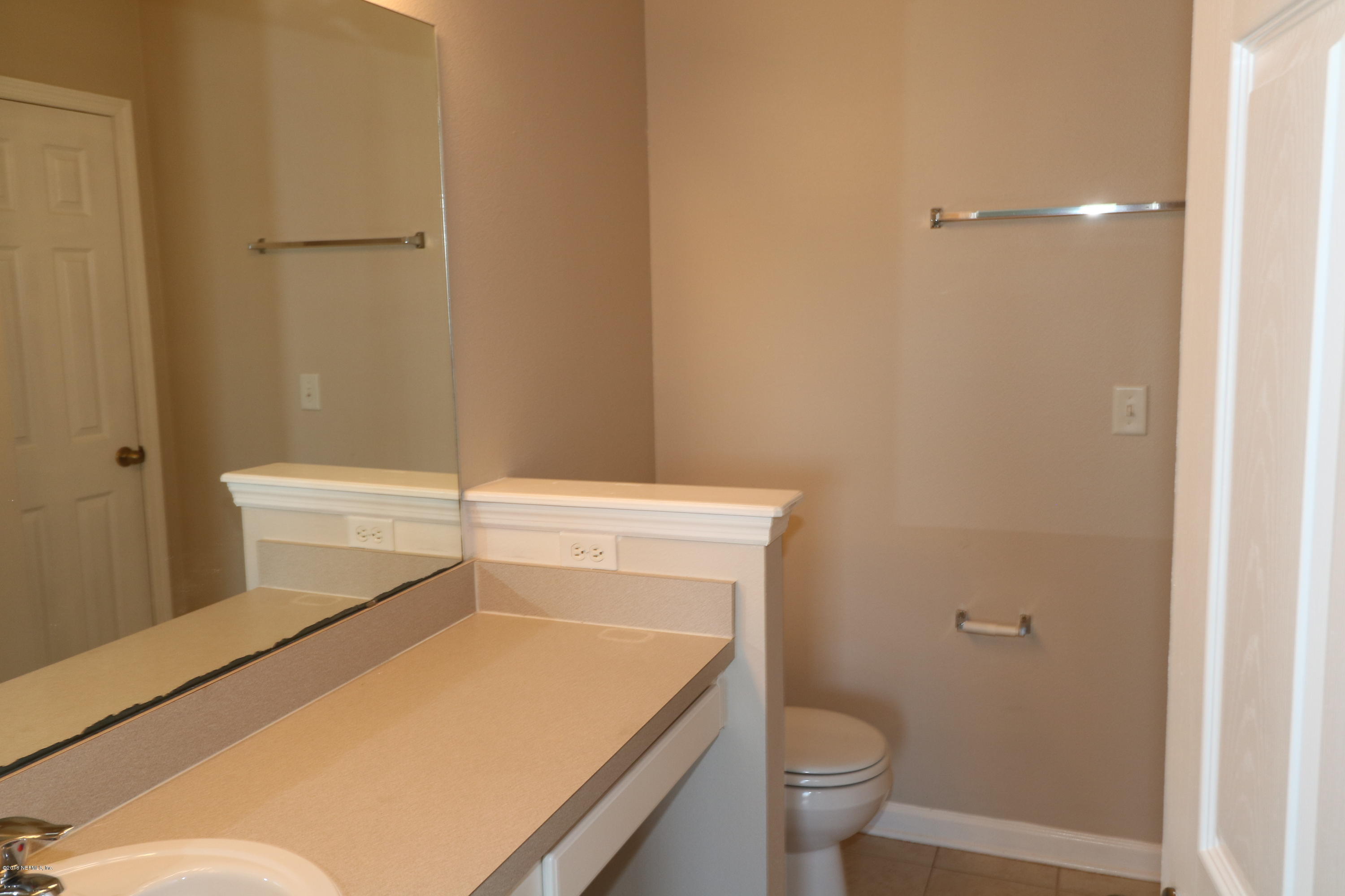584 Crystal Way Orange Park, FL 32065 - Photo 8 of 14 a bathroom with a toilet and a sink