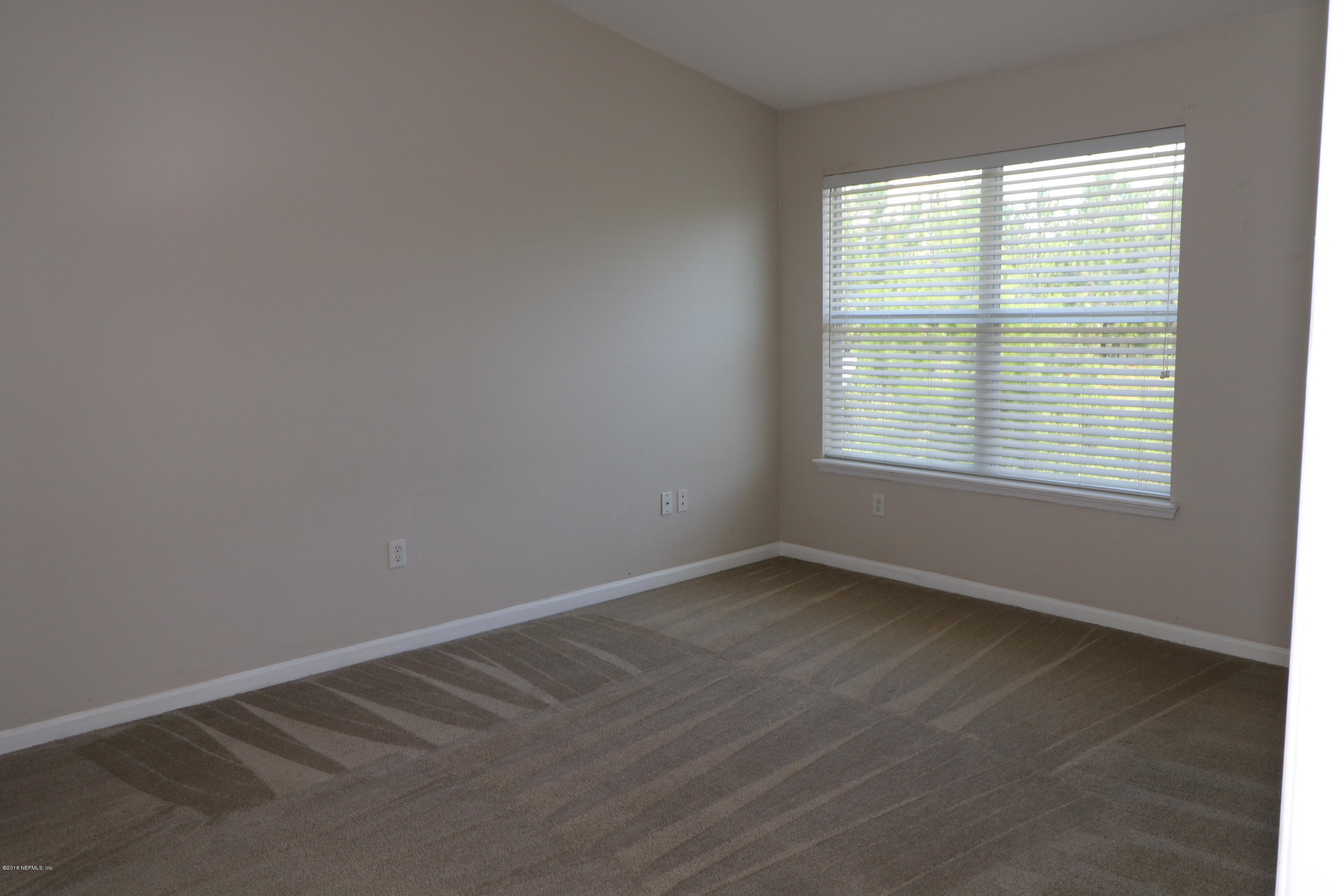 584 Crystal Way Orange Park, FL 32065 - Photo 9 of 14 an empty room with a window