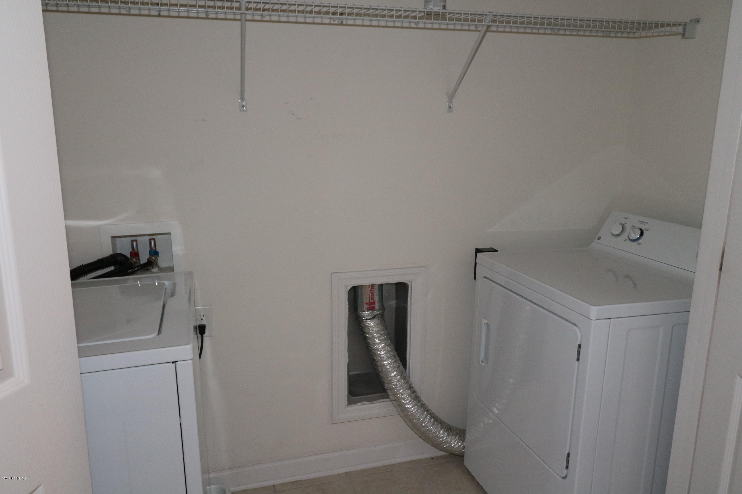 584 Crystal Way Orange Park, FL 32065 - Photo 10 of 14 a bathroom with a shower and toilet