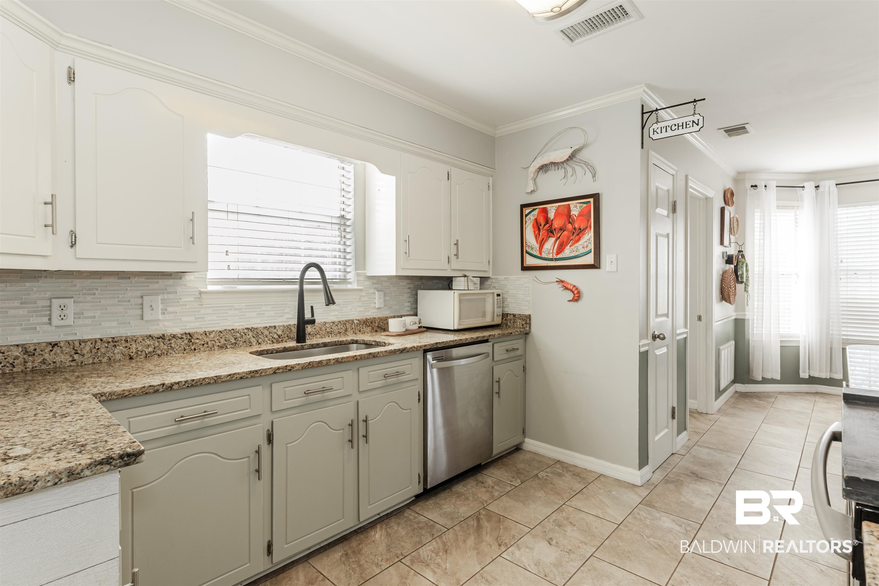 3844 Isabel Way South Mobile, AL 36693 - Photo 11 of 49 Kitchen featuring ornamental molding, dishwasher, sink, and plenty of natural light
