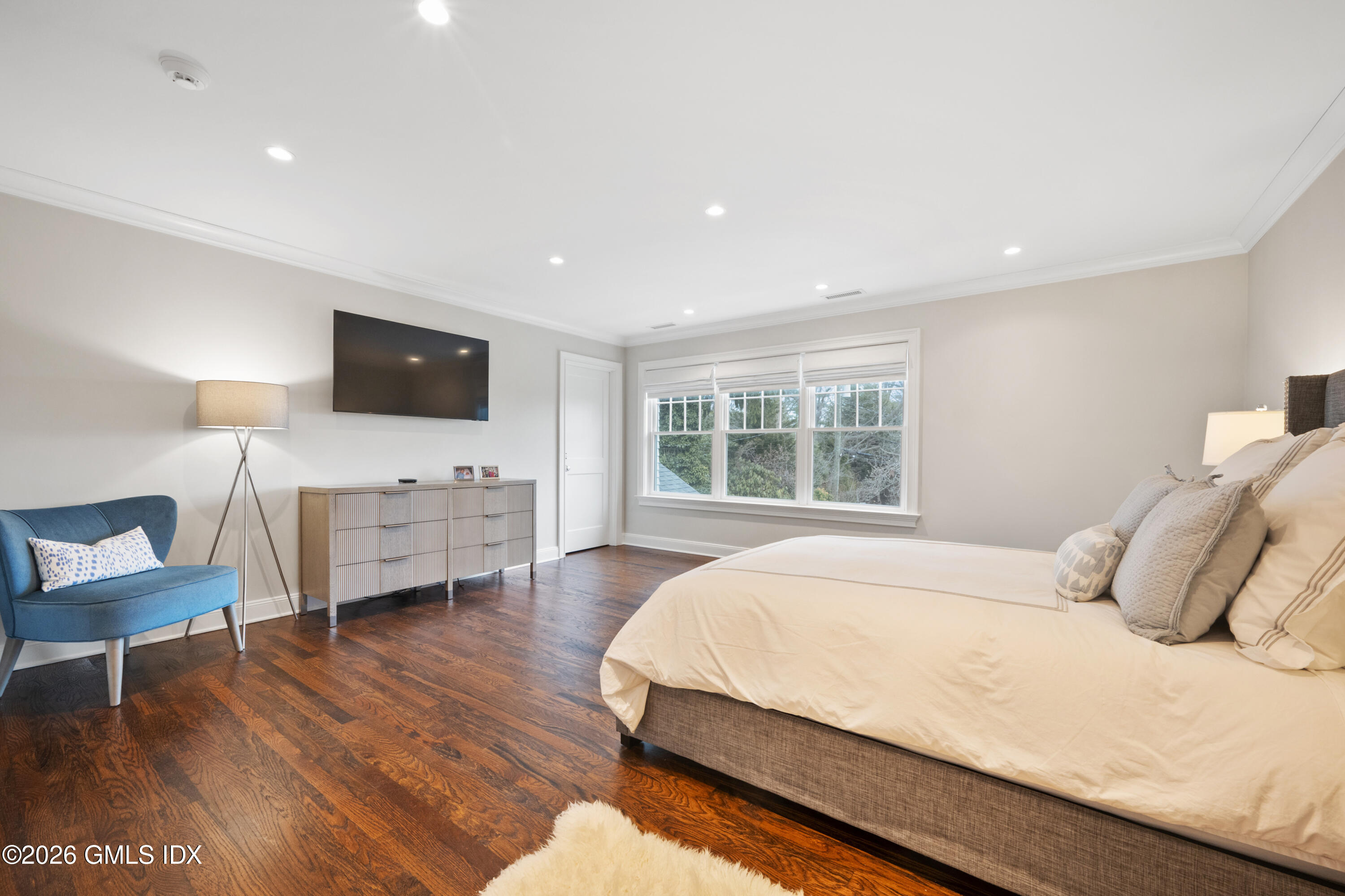 15 Pell Place Riverside, CT 06878 - Photo 16 of 35 a bedroom with a bed and a flat screen tv