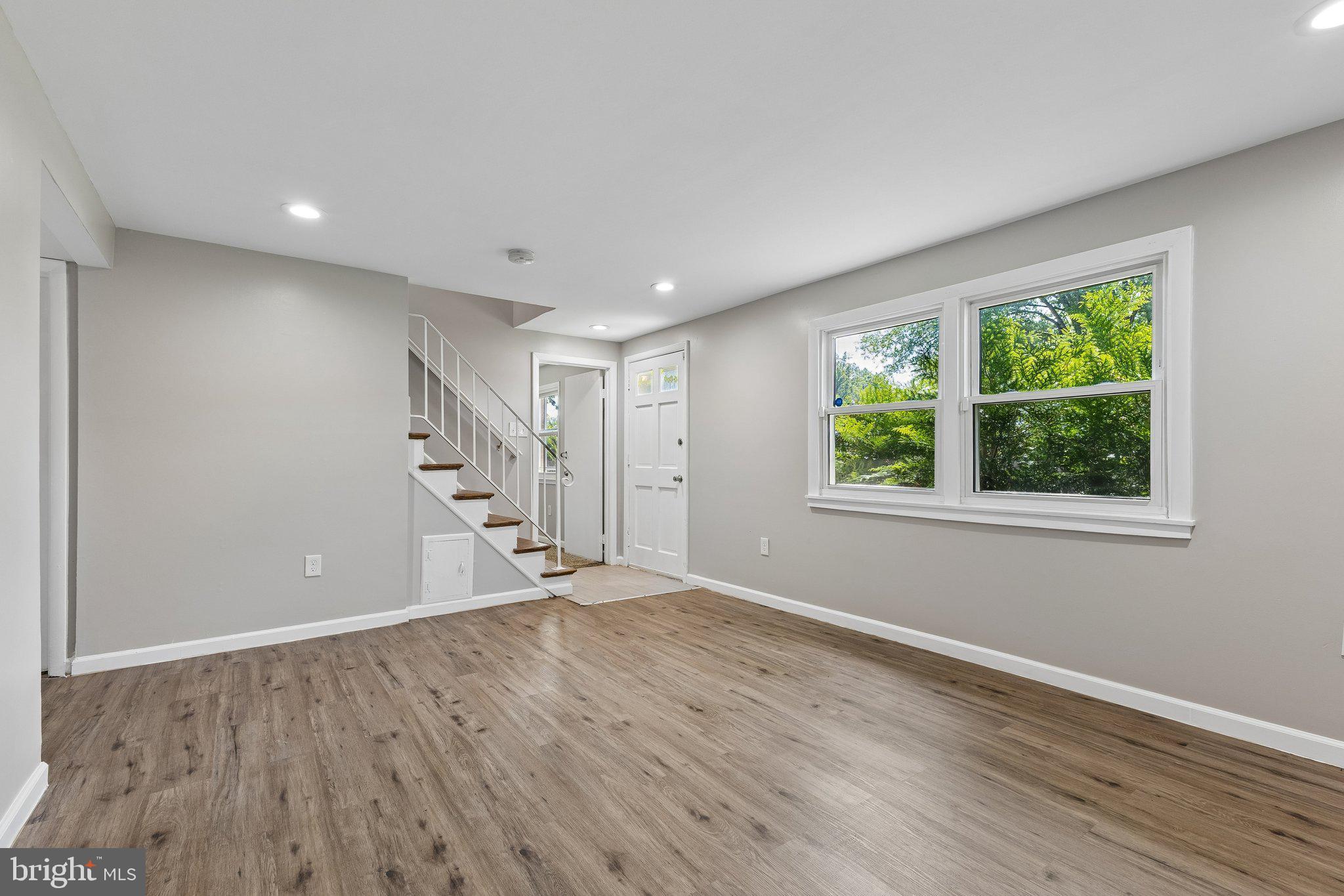 14197 Fullerton Road Woodbridge, VA 22193 - Photo 9 of 23 a view of empty room with wooden floor and fan