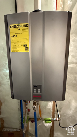 5236 North Holly Way Helper, UT 84526 - Photo 26 of 34 Utility room featuring tankless water heater