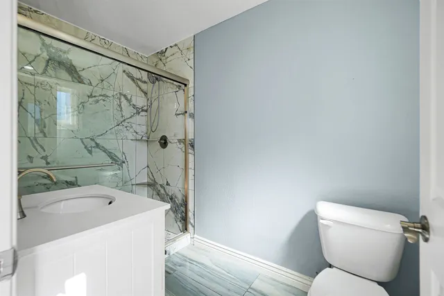 a view of a house with swimming pool and a chairs