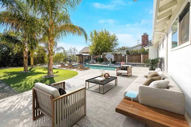 a view of a swimming pool with a patio