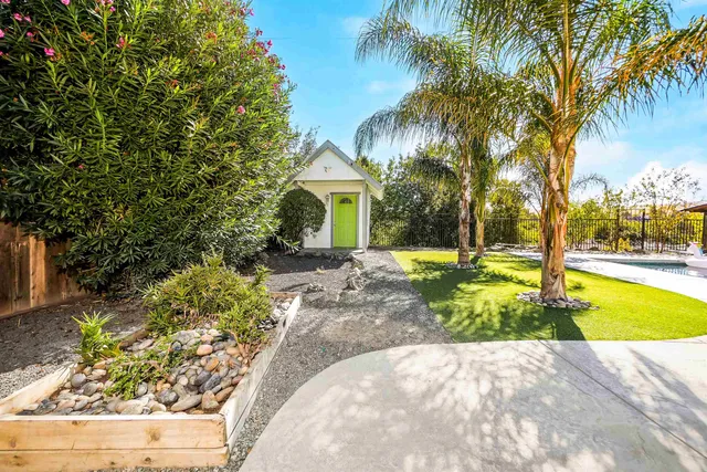 a view of a swimming pool with a patio