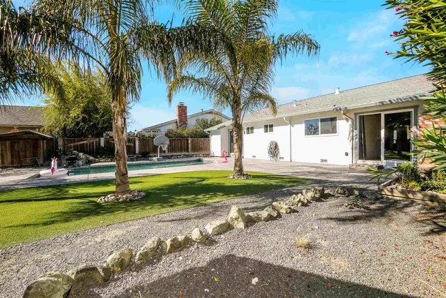 a front view of a house with swimming pool