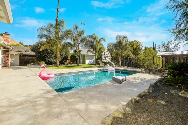 an aerial view of multiple houses with a yard