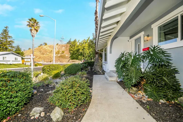 an aerial view of a house with a ocean view