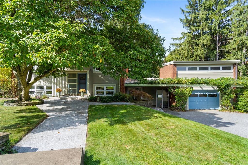17 Penhurst Road Pittsburgh, PA 15202 - Photo 2 of 42 front view of a house with a patio yard and a large tree