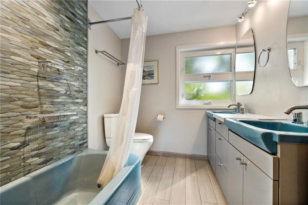 17 Penhurst Road Pittsburgh, PA 15202 - Photo 26 of 42 a bathroom with a sink a toilet and shower