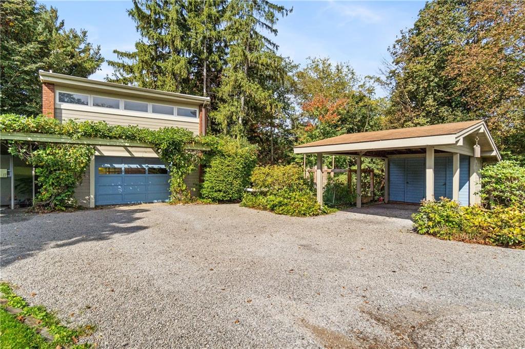 17 Penhurst Road Pittsburgh, PA 15202 - Photo 32 of 42 a front view of a house with a yard and a garage