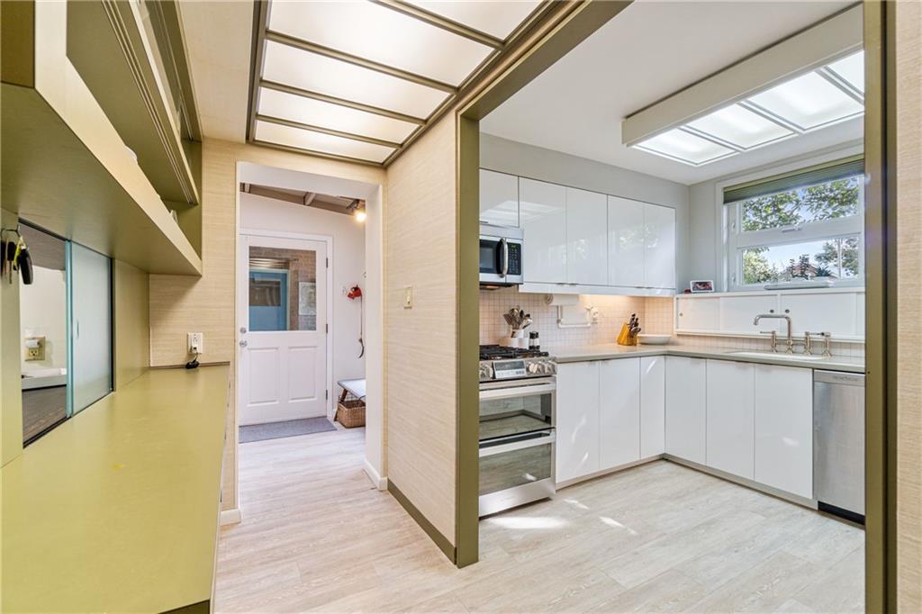 17 Penhurst Road Pittsburgh, PA 15202 - Photo 8 of 42 a kitchen with stainless steel appliances a refrigerator sink and cabinets