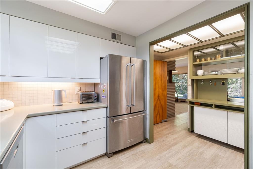 17 Penhurst Road Pittsburgh, PA 15202 - Photo 10 of 42 a kitchen with stainless steel appliances a refrigerator and a stove top oven