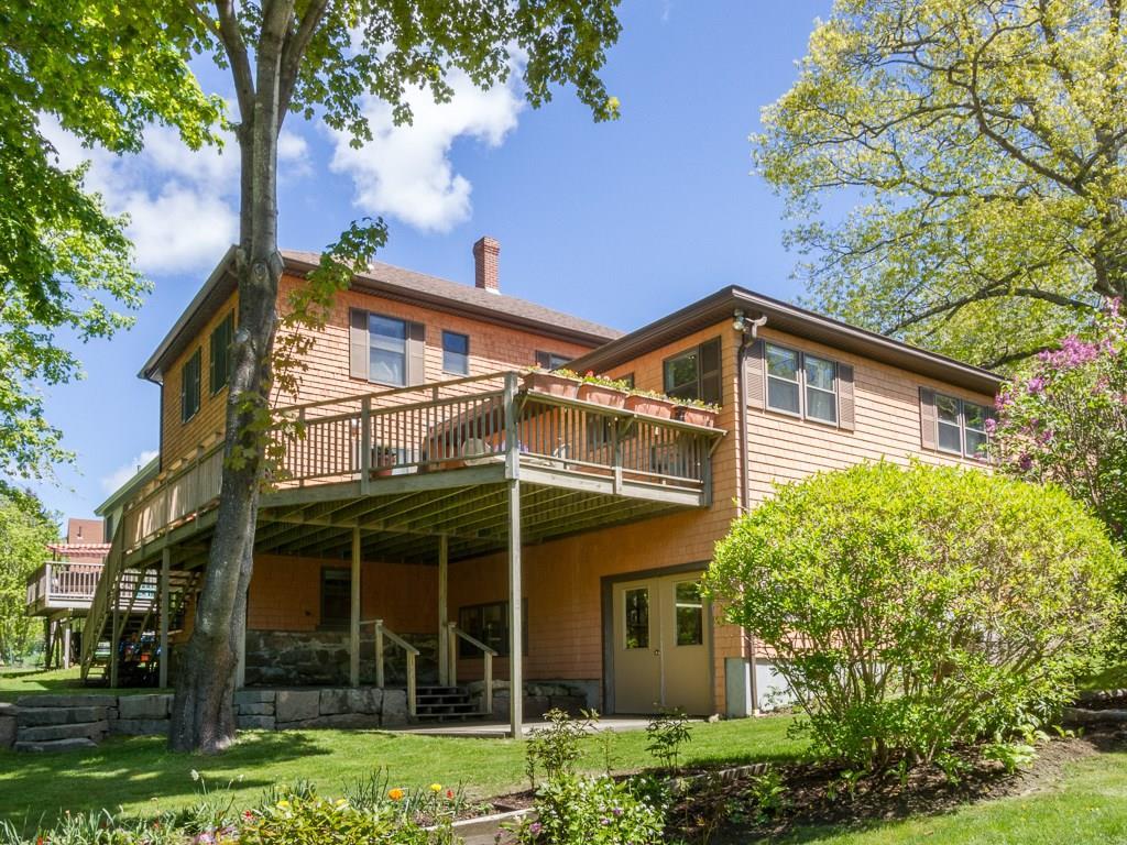 10 Jordan Pond Road Seal Harbor, ME 04675 - Photo 7 of 32 A large deck has stairs to the lower...