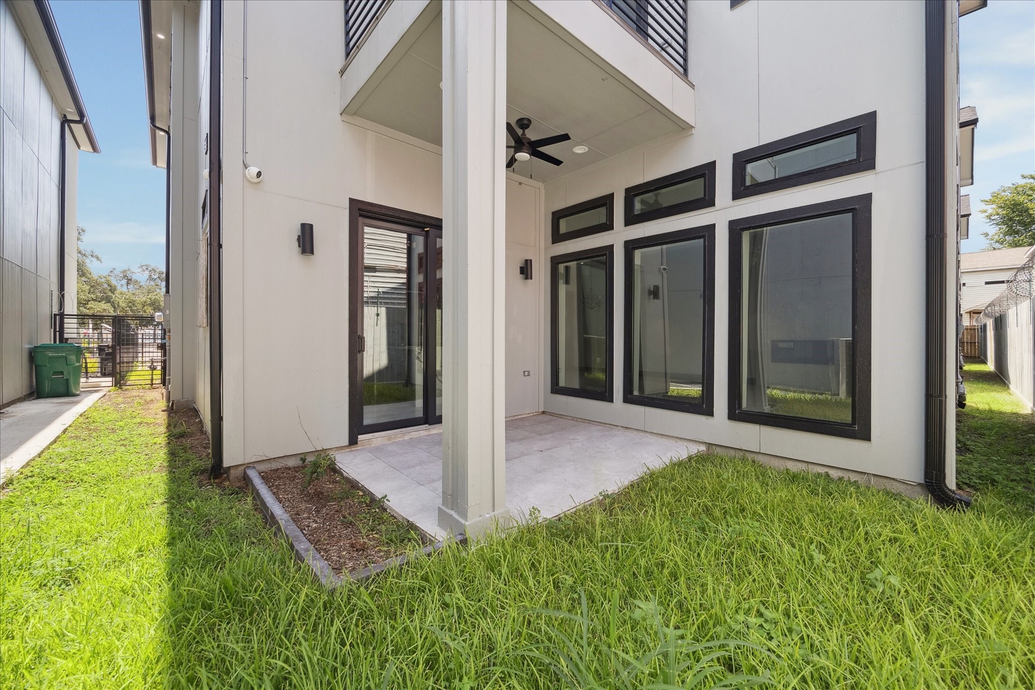 2323 Tuam Street Houston, TX 77004 - Photo 24 of 24 Private yard and covered patio with ceiling fan create an ideal space for entertaining, gardening, or enjoying quiet relaxation.