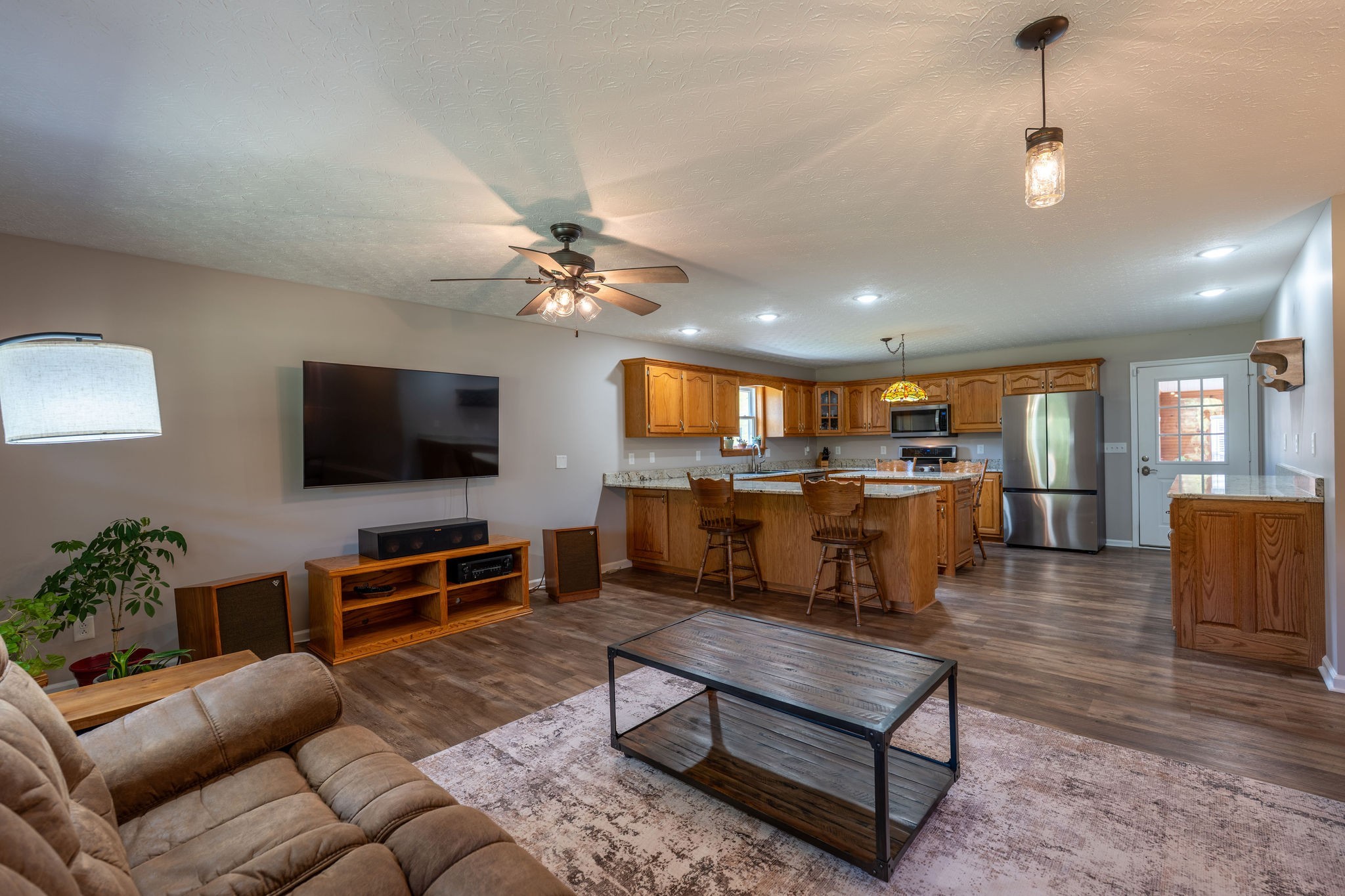 6285 Rayburn Creek Road Collinwood, TN 38450 - Photo 11 of 51 a living room with furniture kitchen view and a flat screen tv