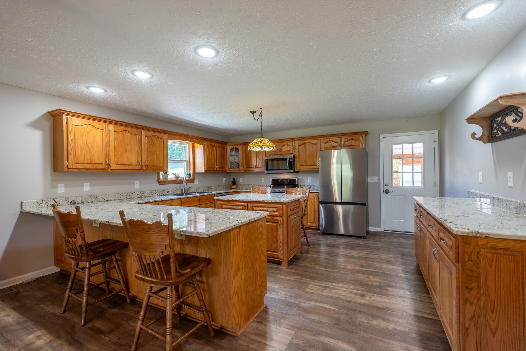 6285 Rayburn Creek Road Collinwood, TN 38450 - Photo 15 of 51 a large kitchen with a table and chairs