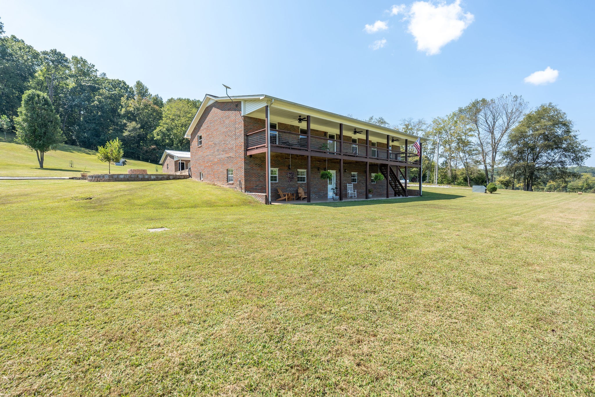 6285 Rayburn Creek Road Collinwood, TN 38450 - Photo 41 of 51 a view of a swimming pool with an outdoor space and seating area