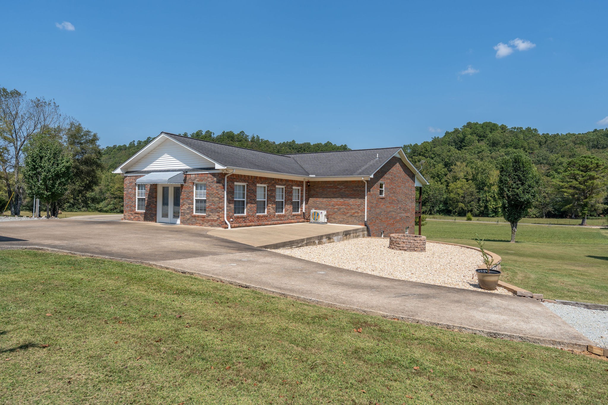 6285 Rayburn Creek Road Collinwood, TN 38450 - Photo 50 of 51 a front view of a house with a yard and trees