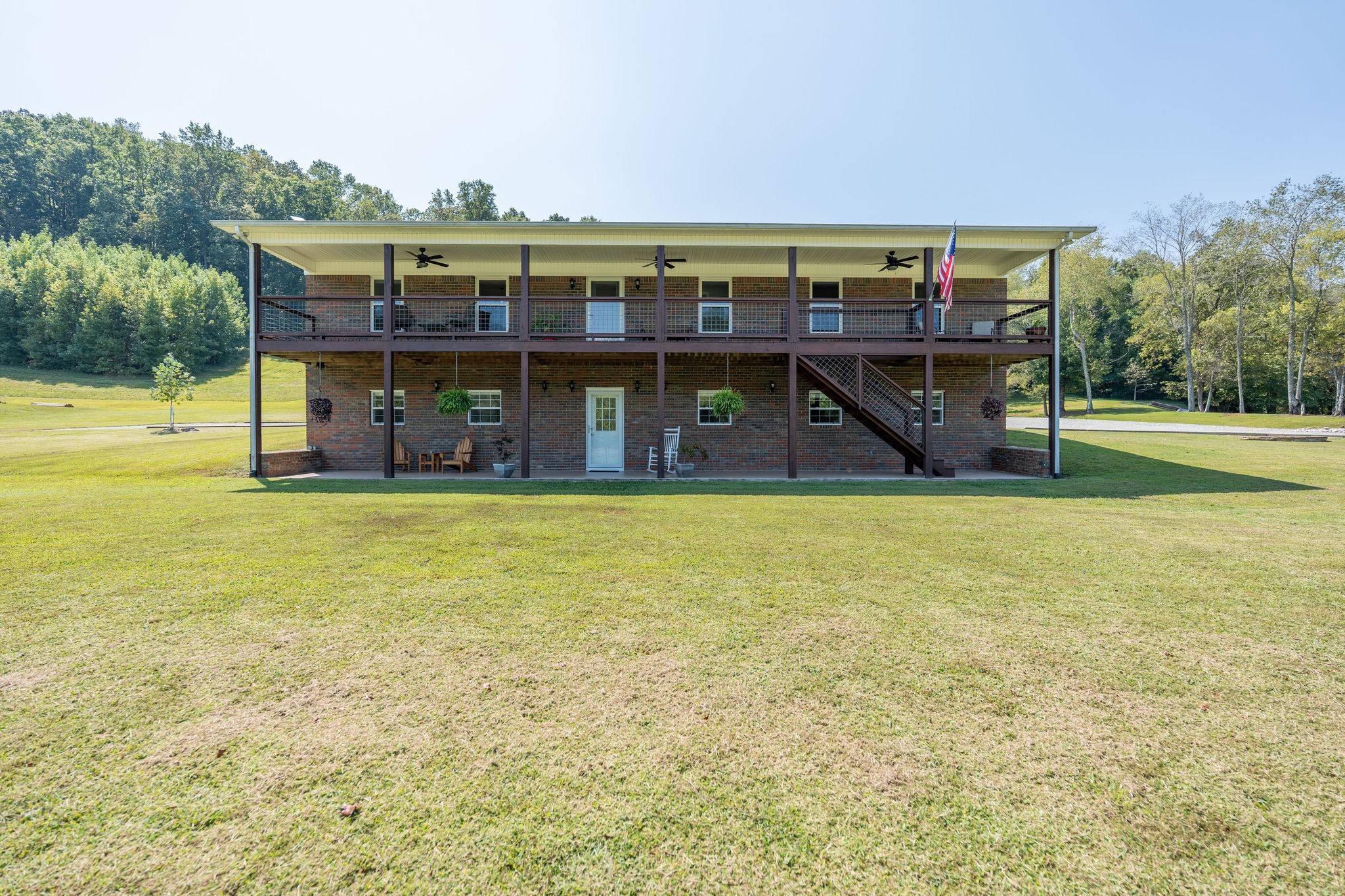 6285 Rayburn Creek Road Collinwood, TN 38450 - Photo 5 of 51 a view of a large pool with lawn chairs and large trees