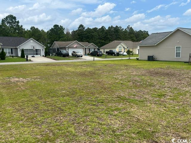 621 West Perry Road Myrtle Beach, SC 29579 - Photo 8 of 18 View of yard with a residential view and cooling u