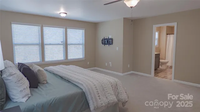 a bathroom with a double vanity sink toilet and shower