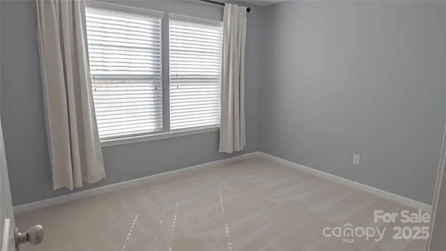 a view of a house with backyard and a garden