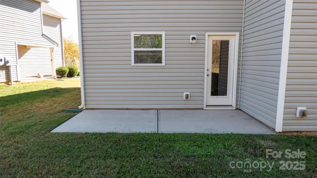 a view of a backyard with large trees
