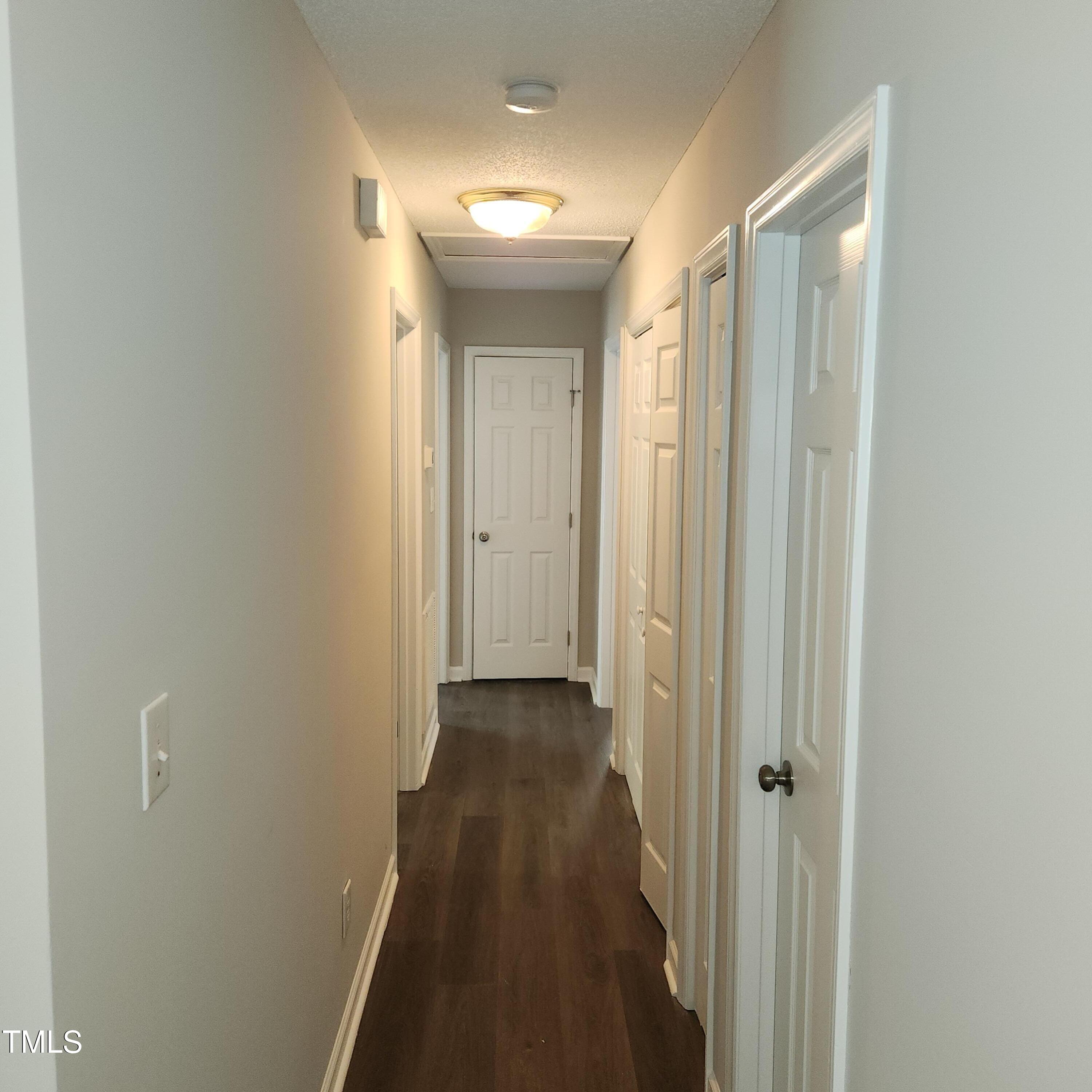 132 Waiters Way Youngsville, NC 27596 - Photo 16 of 30 a view of a hallway with wooden floor