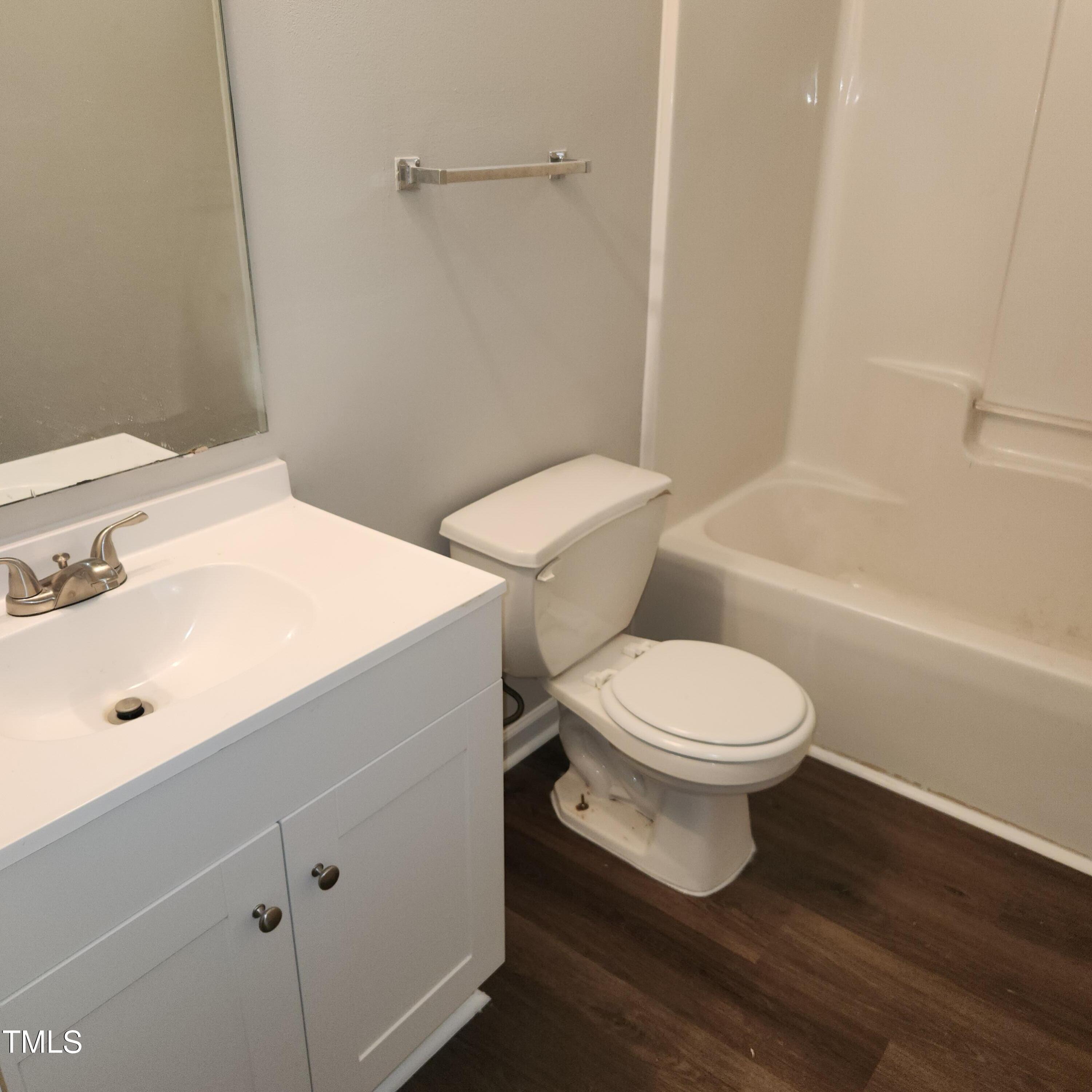 132 Waiters Way Youngsville, NC 27596 - Photo 17 of 30 a white toilet sitting next to a bathroom sink