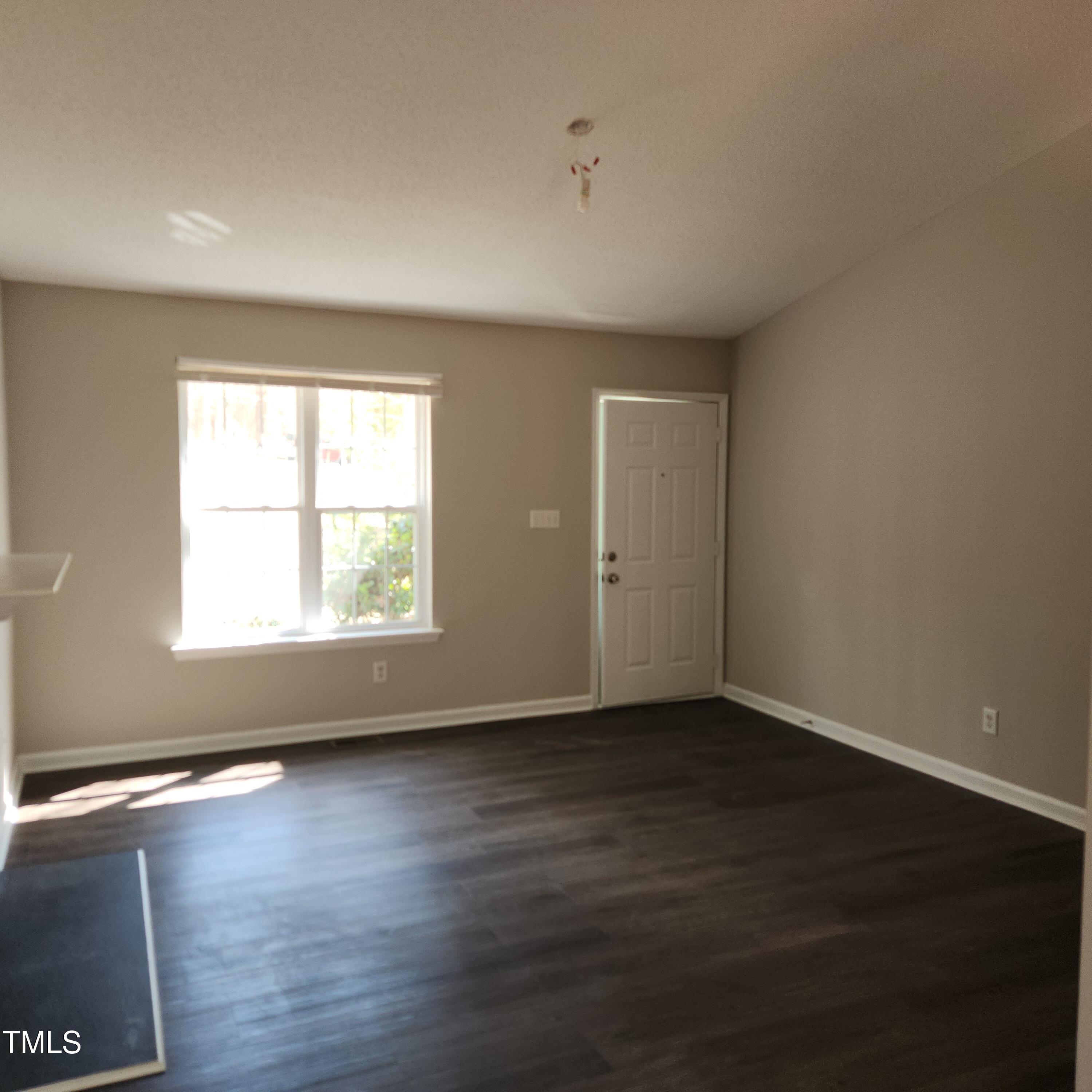 132 Waiters Way Youngsville, NC 27596 - Photo 19 of 30 an empty room with wooden floor and windows