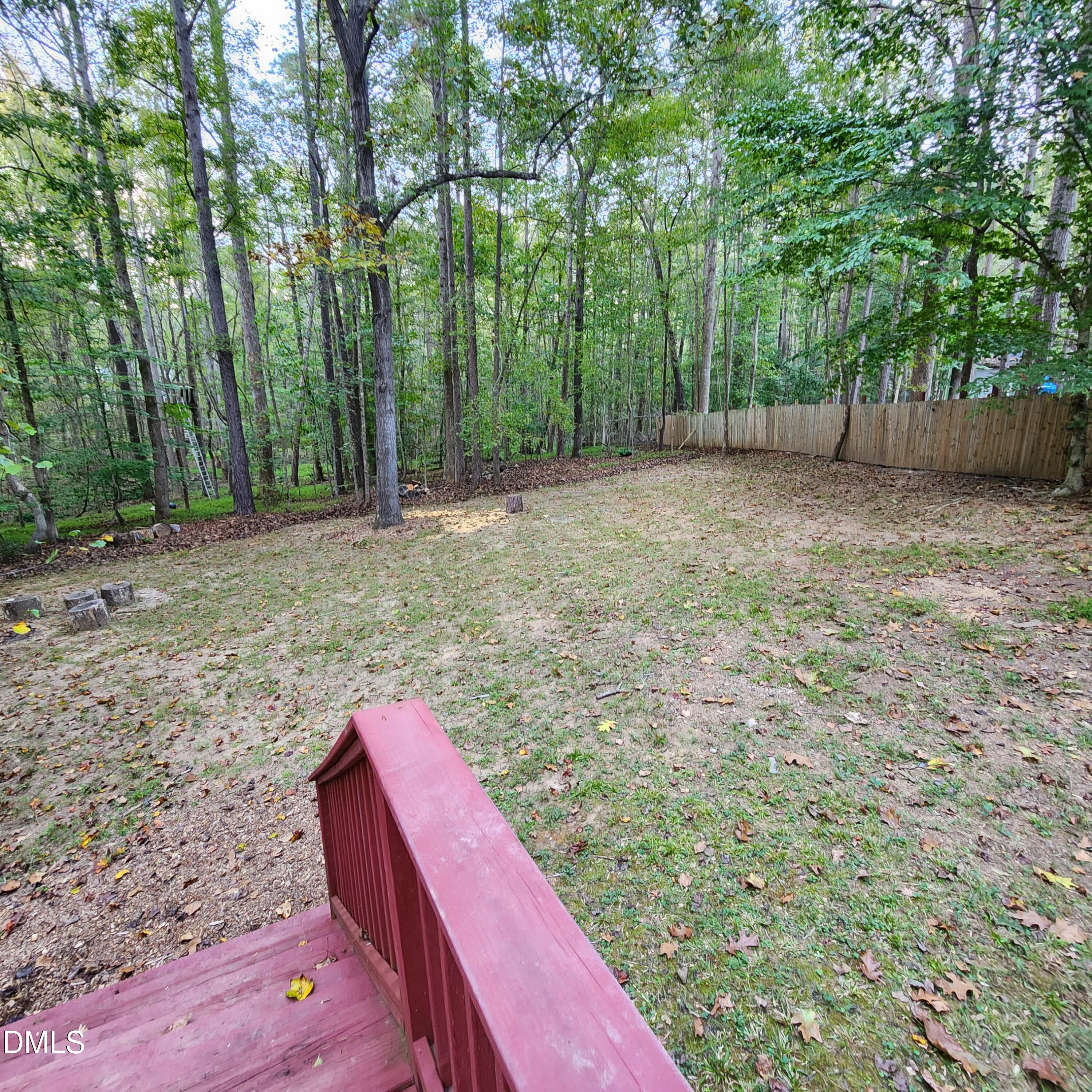132 Waiters Way Youngsville, NC 27596 - Photo 27 of 30 a view of a backyard with large trees