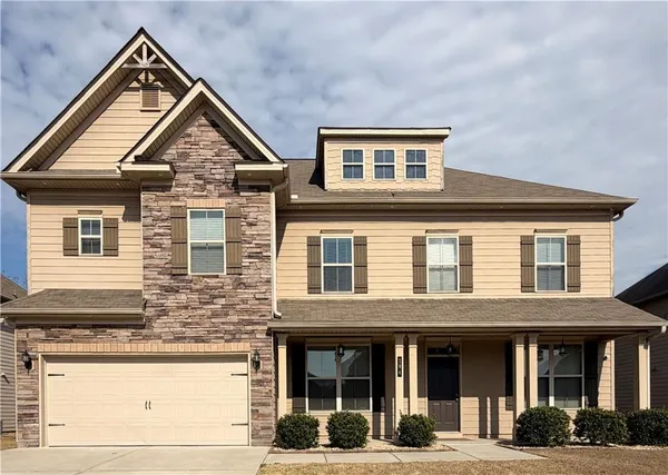 a large kitchen with a table and chairs