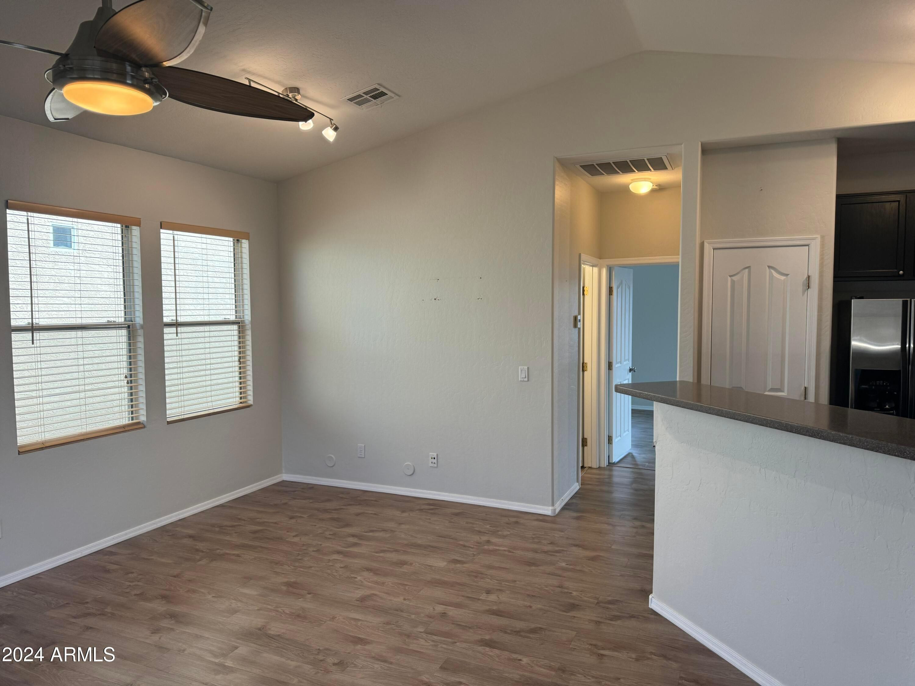 446 North Alder Court Gilbert, AZ 85233 - Photo 15 of 25 wooden floor in an empty room with a window