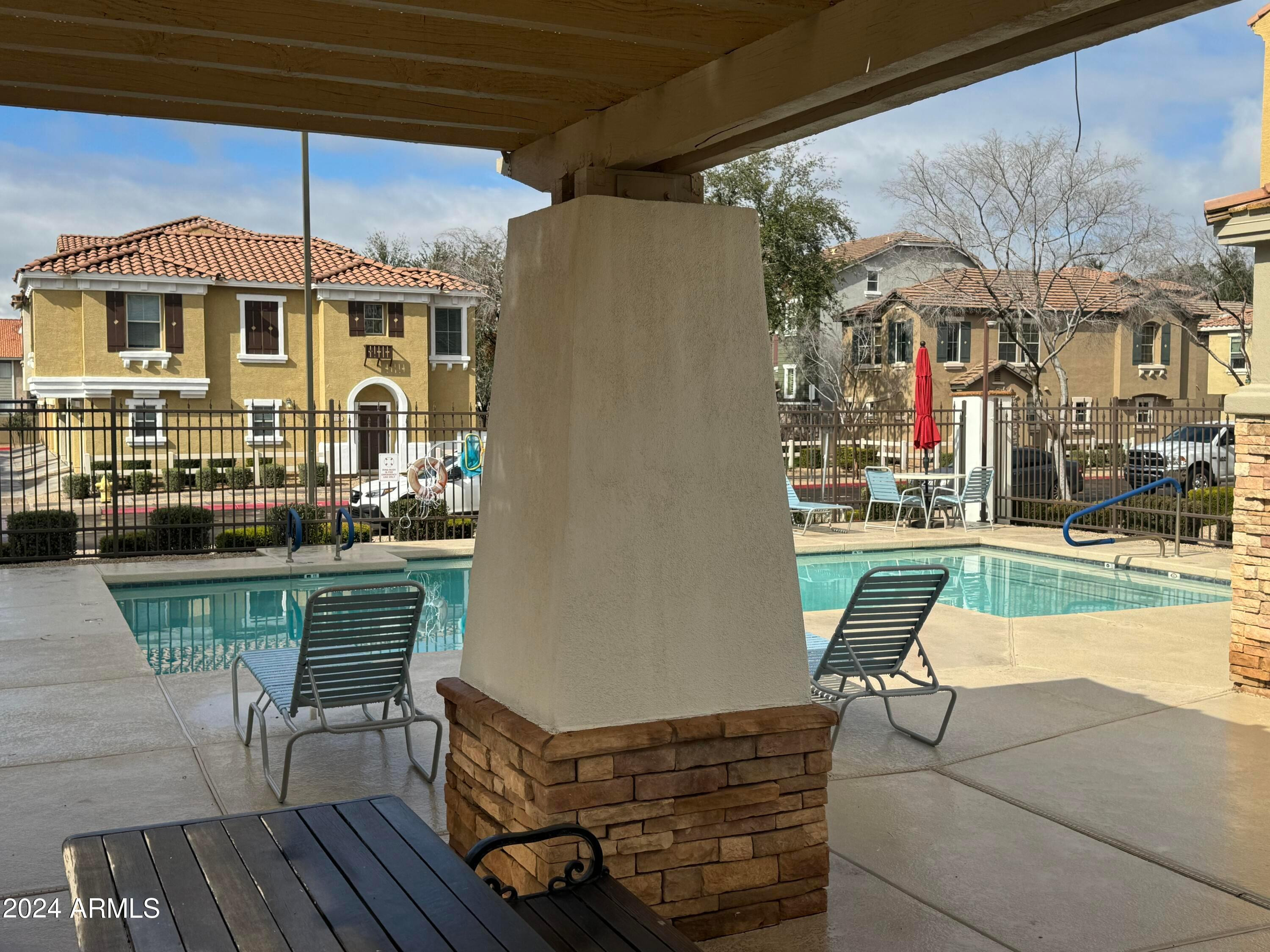 446 North Alder Court Gilbert, AZ 85233 - Photo 21 of 25 a patio with a table and chairs