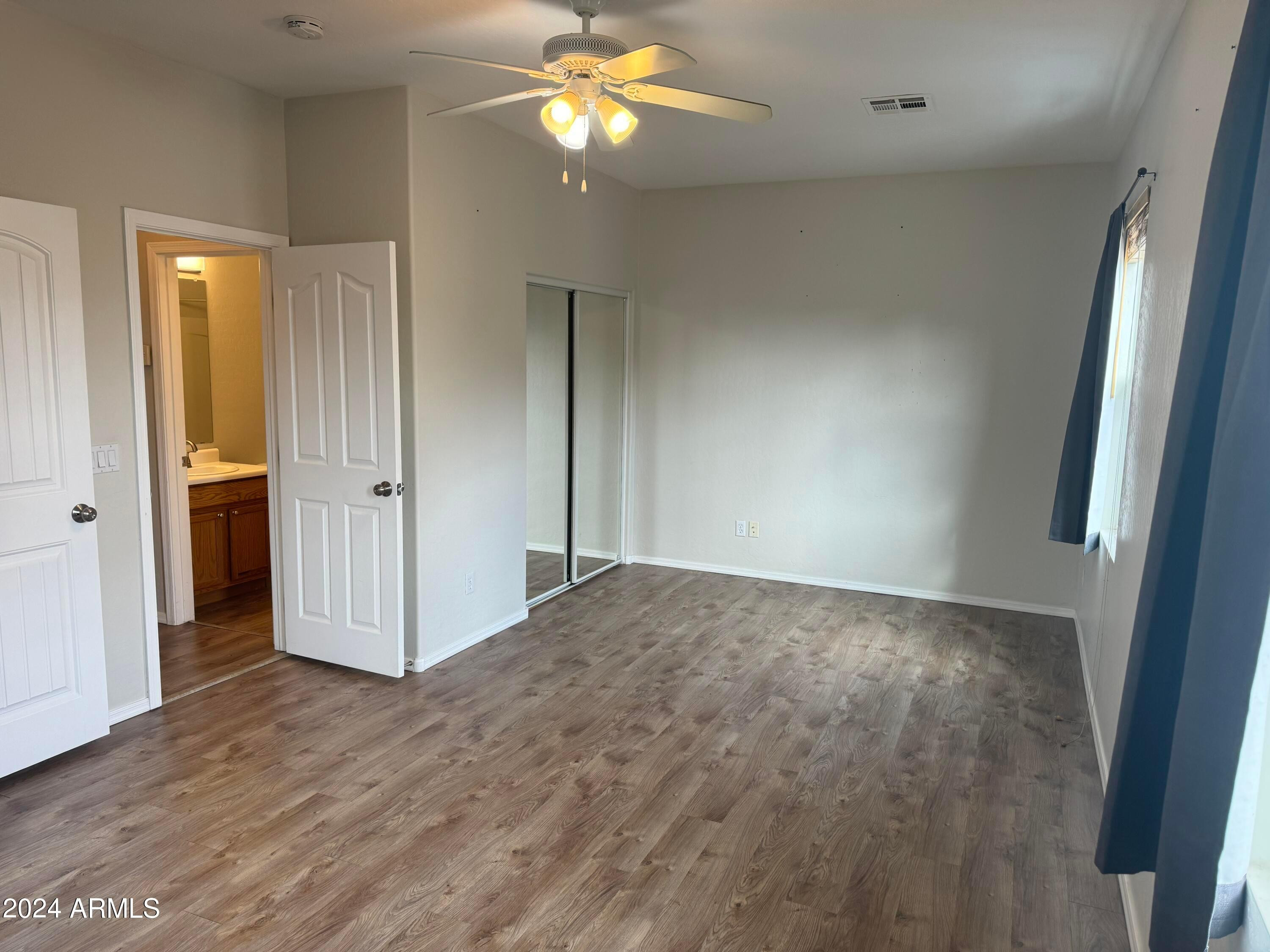 446 North Alder Court Gilbert, AZ 85233 - Photo 10 of 25 a view of empty room with wooden floor