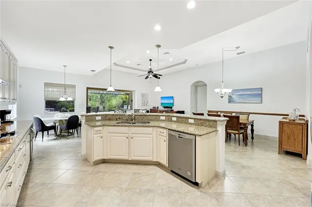 a kitchen with lots of counter top space and dining table