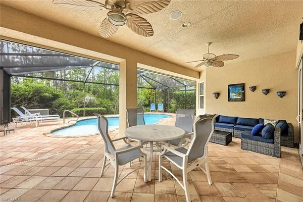 a view of a dining room with furniture wooden floor and chandelier