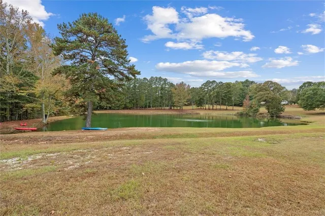 a view of a lake with a yard