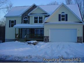7 Pond Ridge Drive Scranton, PA 18504 - Photo 1 of 6 a view of a house with a yard