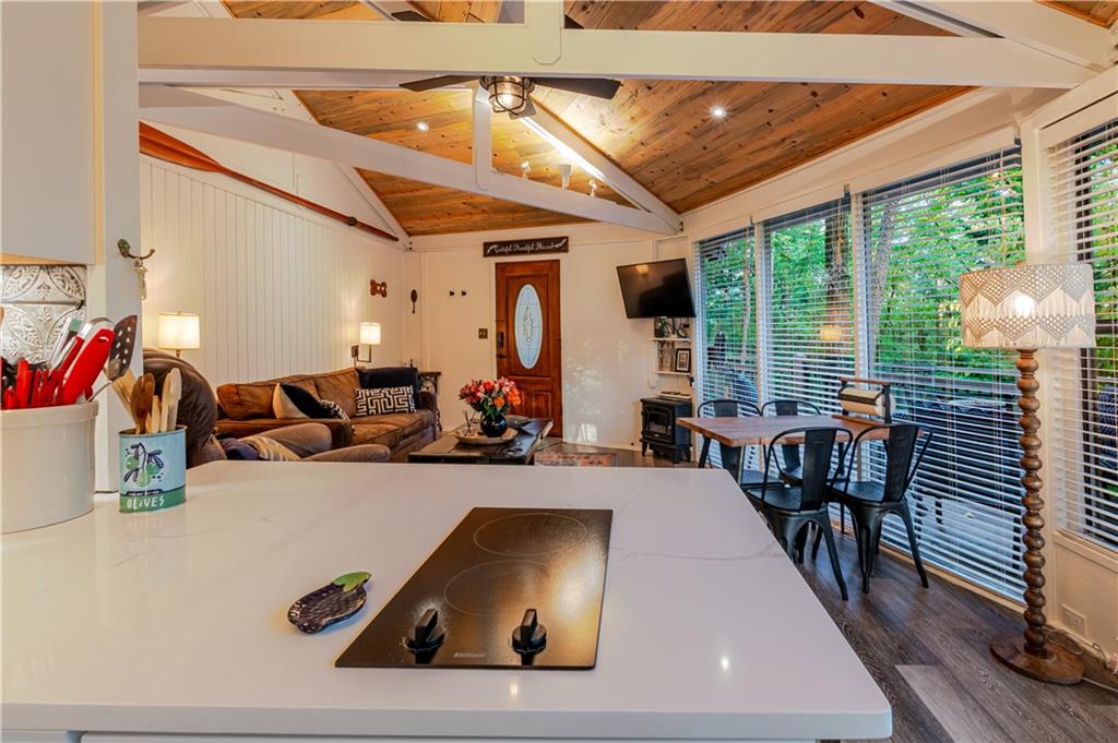 150 Treetopper Circle Big Canoe, GA 30143 - Photo 18 of 26 a living room with furniture and a large window