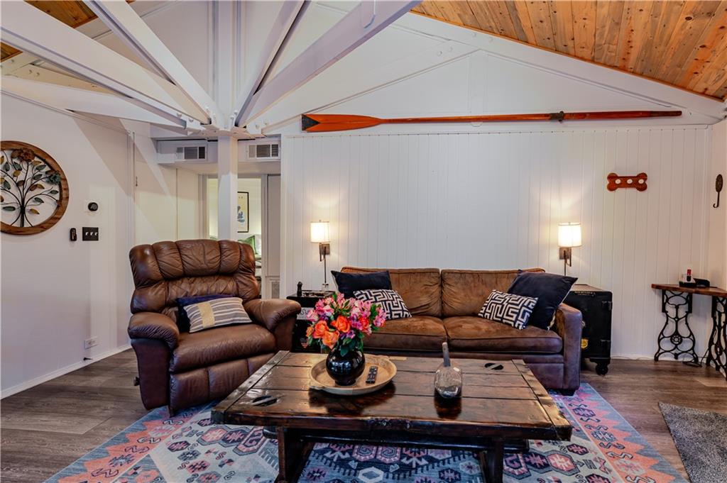 150 Treetopper Circle Big Canoe, GA 30143 - Photo 20 of 26 a living room with furniture a rug and a chandelier
