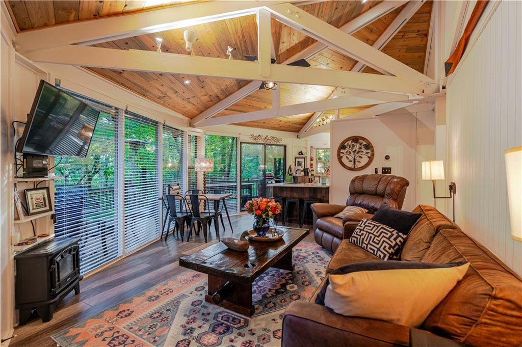 150 Treetopper Circle Big Canoe, GA 30143 - Photo 22 of 26 a living room with furniture a rug and a clock