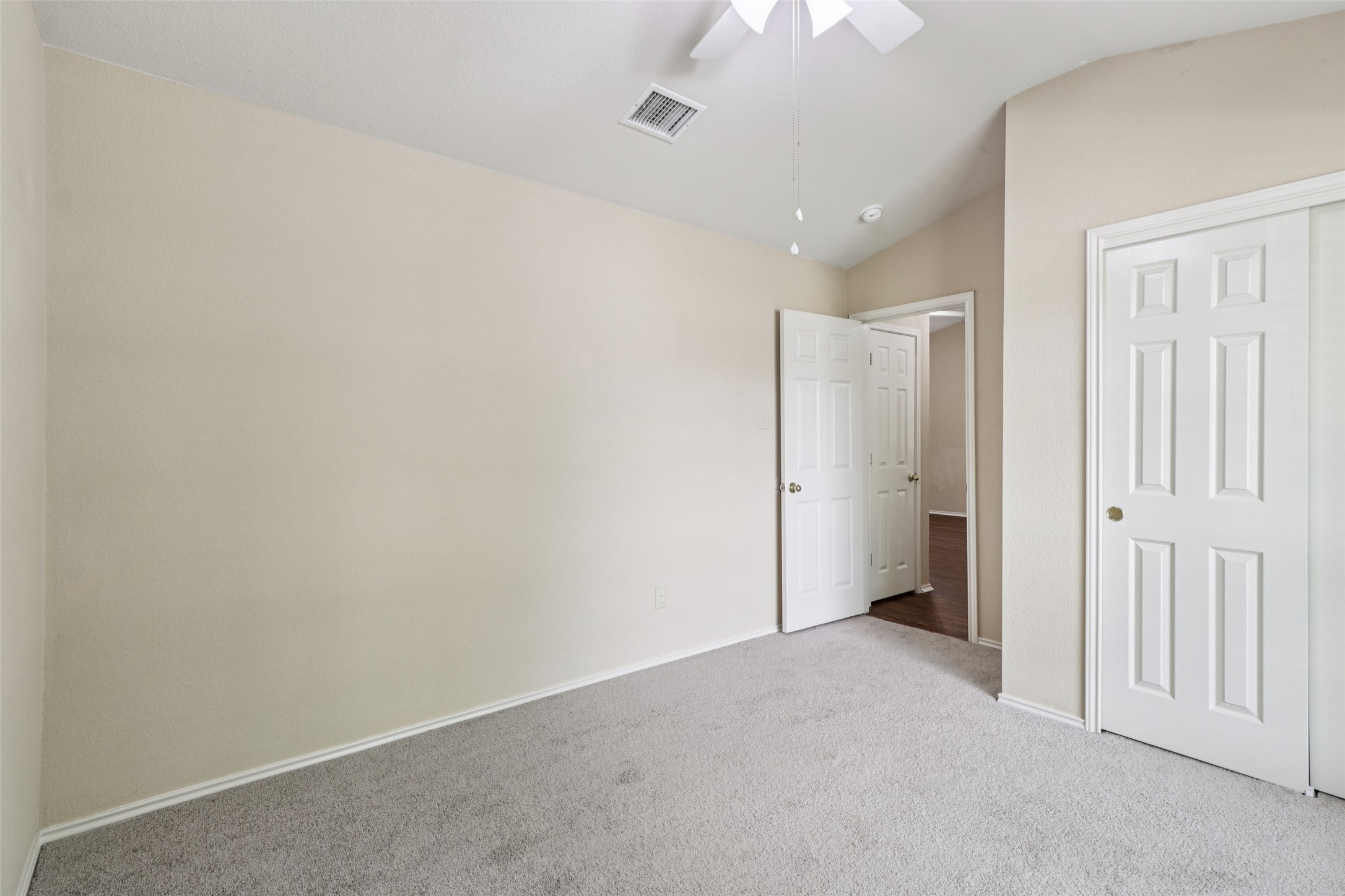 700 Scheel Road Kyle, TX 78640 - Photo 30 of 39 This room features light-colored walls, grey carpet flooring, and white interior doors